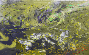 Fig.1: Visible image with 500 hPa data atop (wind as barbs, black line for geopotential heights and the coloured lines for the temperature).