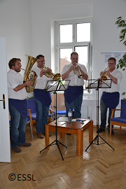 brass band playing during Grand Opening